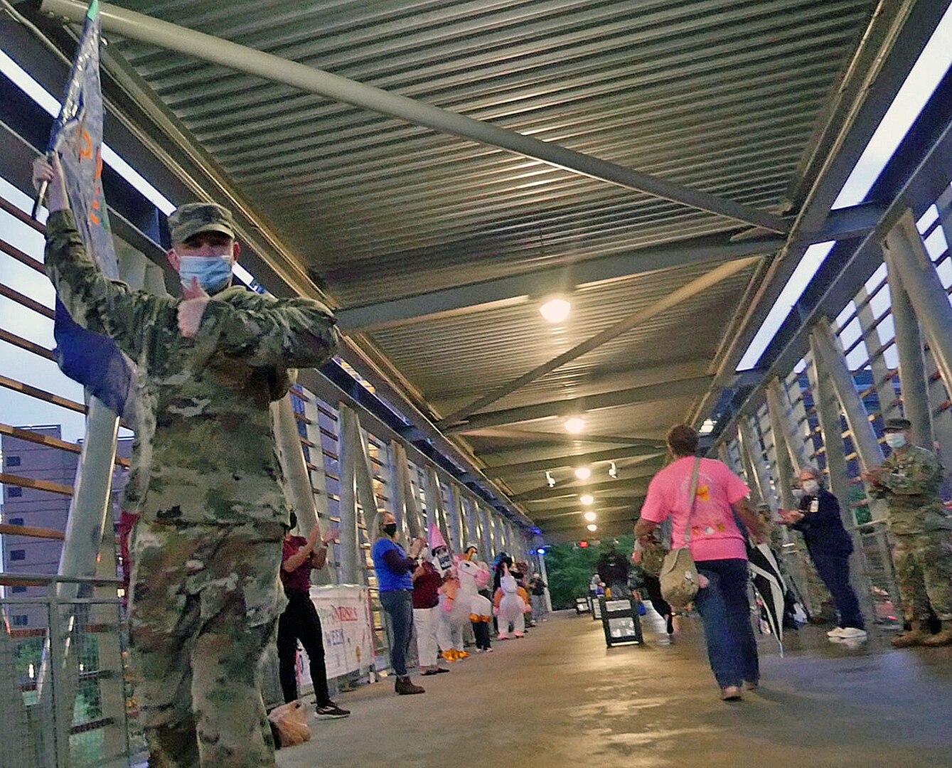 Staff members from the Brooke Army Medical Center’s critical care department line the walkway to greet and cheer on BAMC staff members as they come to work May 12. The critical care department chose the date – which is both the end of Nurses Week and Florence Nightingale’s birthday – to celebrate all the BAMC staff who work to ensure high quality care for patients.