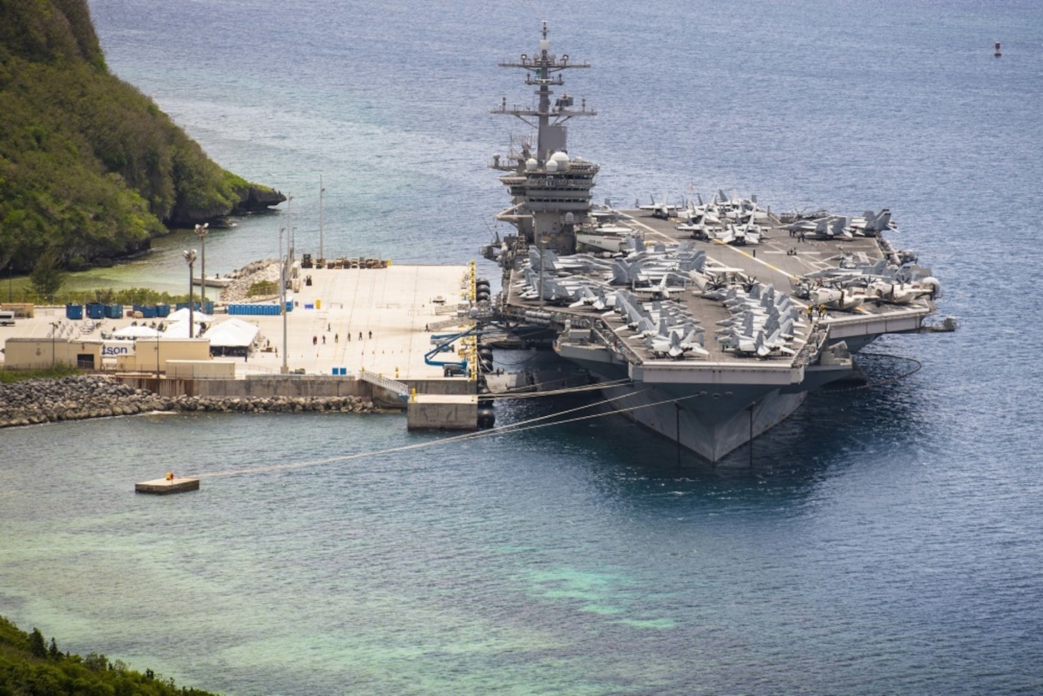 NAVAL BASE GUAM (May 15, 2020) The aircraft carrier USS Theodore Roosevelt (CVN 71) is moored pier side at Naval Base Guam May 15, 2020. Theodore Roosevelt's COVID-negative crew returned from quarantine beginning on April 29 and is making preparations to return to sea to continue their scheduled deployment to the Indo-Pacific.