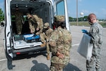 Volunteers Serve Food to New Recruits