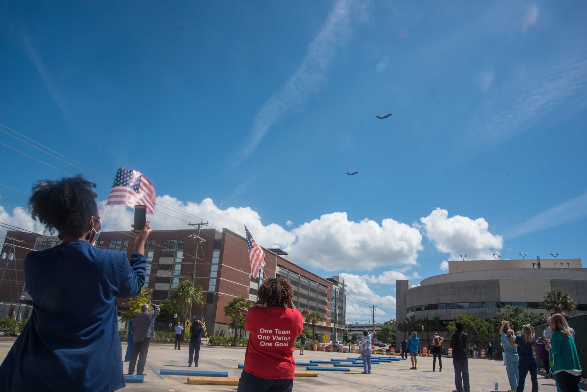 Joint Base Charleston Airmen from the 315th Airlift Wing and 437th Airlift Wing, came together to train during a flyover saluting healthcare workers in the fight against COVID-19, May 15, 2020, over several medical centers including Ralph H. Johnson VA Medical Center in Charleston, South Carolina. Two C-17 Globemaster IIIs from Joint Base Charleston’s 437th and 315th Airlift Wings here saluted local medical professionals and first responders during a flyover Friday.