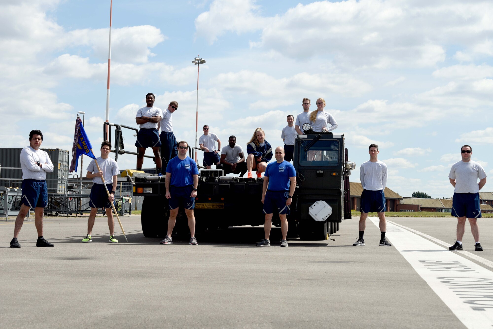 Airmen from the 727th Air Mobility Squadron pose for a photo prior to the Port Dawg Memorial Run at RAF Mildenhall, England, May 15, 2020. Air transportation community members, commonly referred to as “Port Dawgs,” are responsible for military logistics-related aerial ports across the Air Force. (U.S. Air Force photo by Senior Airman Brandon Esau)