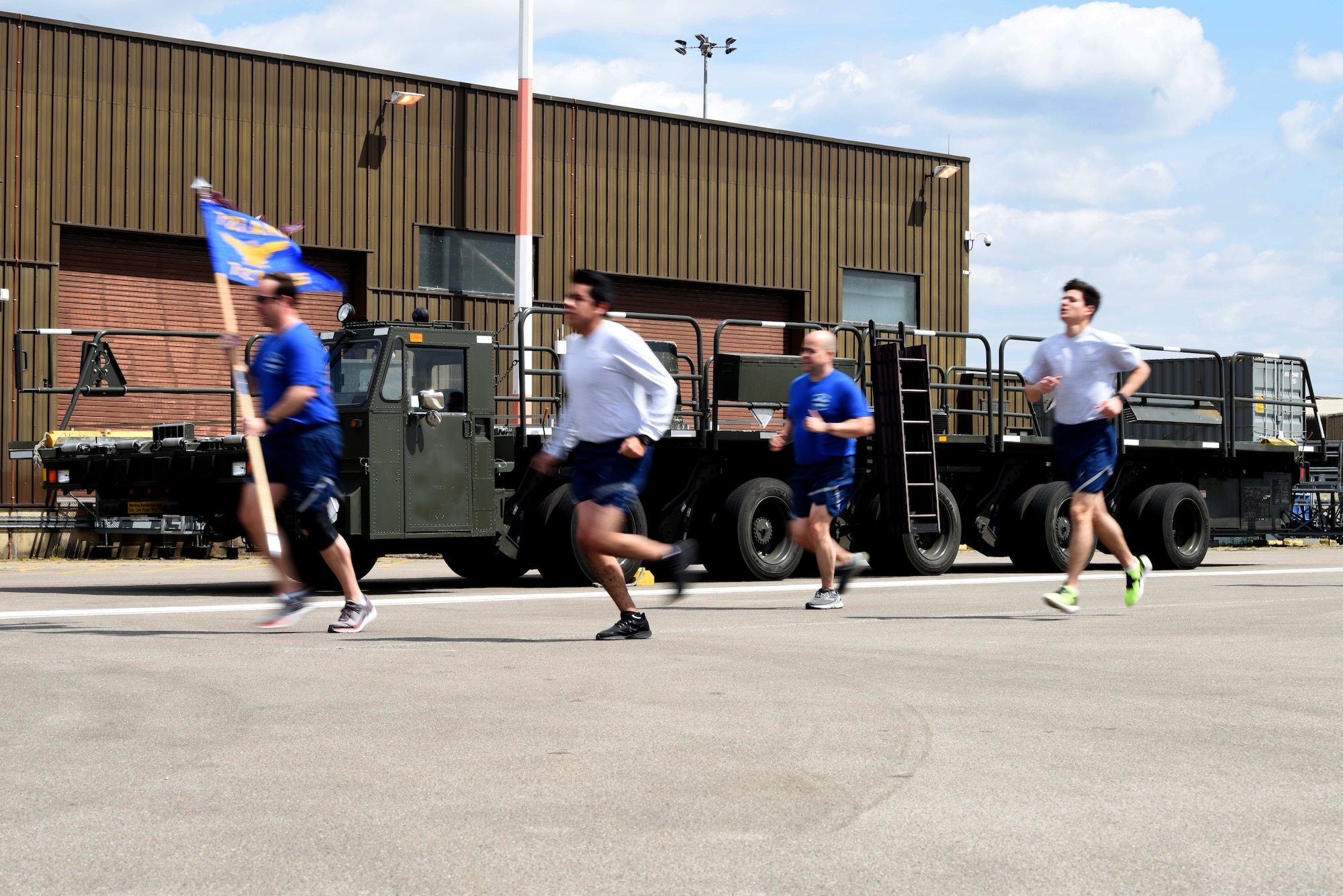 Airmen from the 727th Air Mobility Squadron run during the annual Port Dawg Memorial Run at RAF Mildenhall, England, May 15, 2020. Air transportation community members, commonly referred to as “Port Dawgs,” are responsible for military logistics-related aerial ports across the Air Force. (U.S. Air Force photo by Senior Airman Brandon Esau)