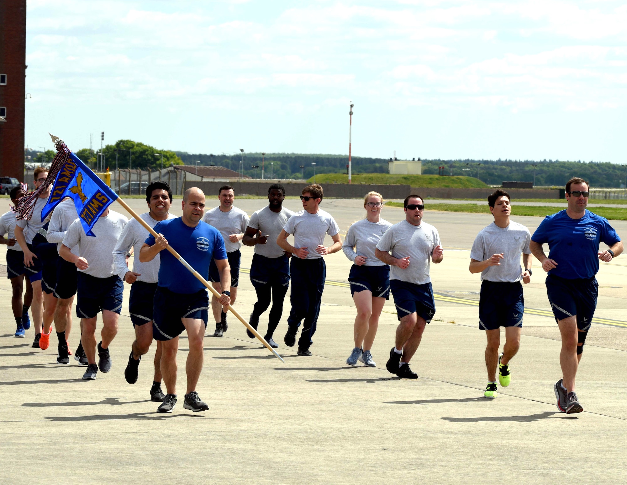 Airmen from the 727th Air Mobility Squadron run during the Port Dawg Memorial Run at RAF Mildenhall, England, May 15, 2020. Air transportation community members, commonly referred to as “Port Dawgs,” are responsible for military logistics-related aerial ports across the Air Force. (U.S. Air Force photo by Senior Airman Brandon Esau)