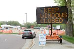A sign at the entrance of the COVID-19 test site in Sioux City, Iowa, instructs motorists to keep their windows closed as they make their way to a temporary drive-through test site at the Western Iowa Technical Community College parking lot, May 7, 2020.