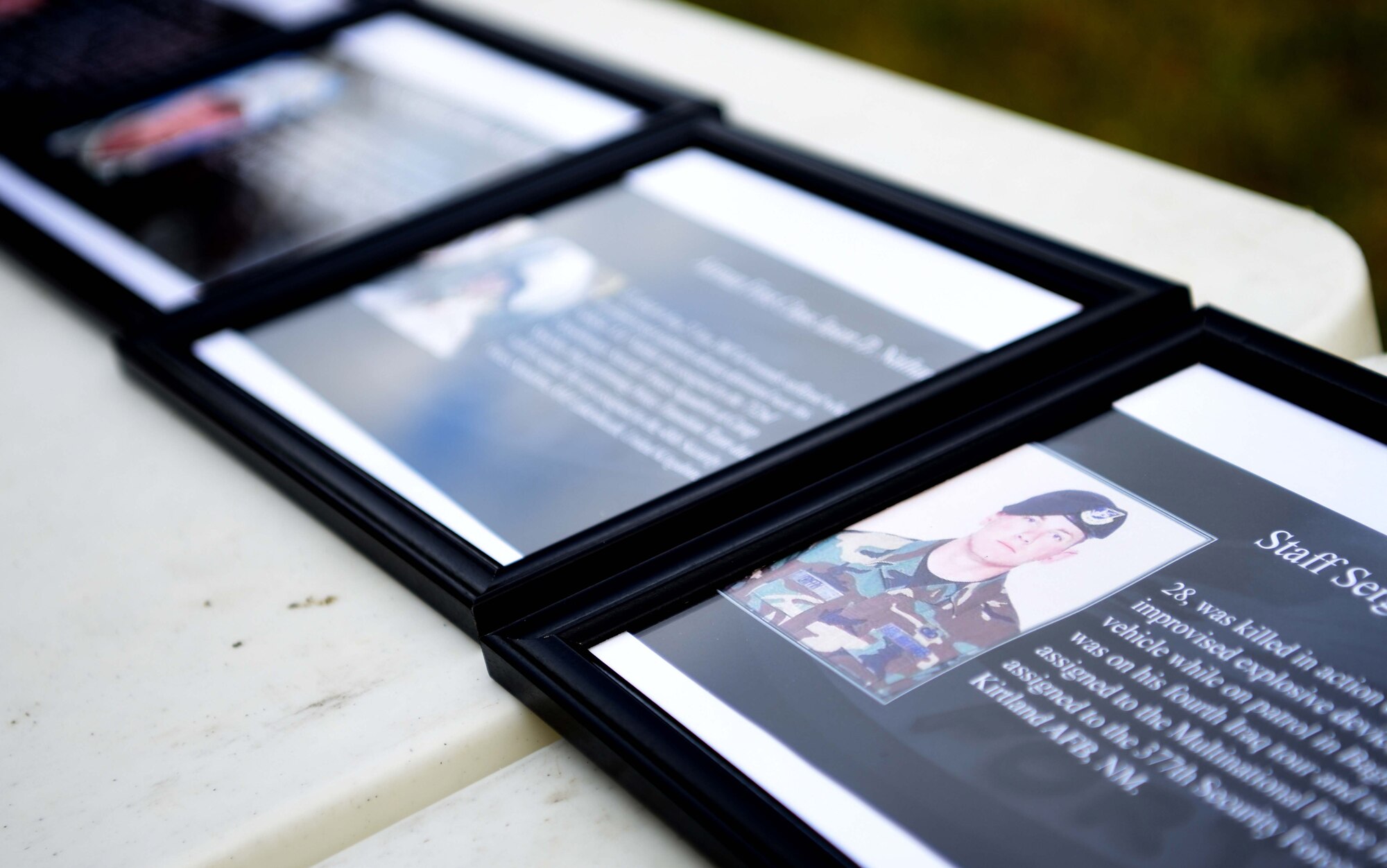 Photos of Air Force Security Forces Airmen who’ve fallen in the line of duty are displayed during events to commemorate National Police Week at RAF Mildenhall, England, May 13, 2020. National Police Week is an observance in the United States which pays tribute to local, state and federal officers who’ve died or who’ve been disabled in the line of duty. (U.S. Air Force photo by Senior Airman Brandon Esau)