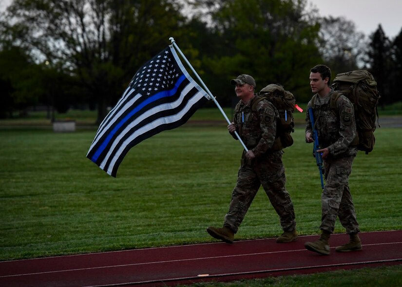 Photo of Airmen walking on a track.