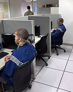Air Force Echo Flight trainees attend their distance learning classes in the 737th Training Support Squadron learning lab, although separated physically from their classmates to due to COVID-19.