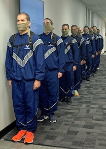 Air Force Echo Flight trainees stand in line in the halls of DLIELC.
