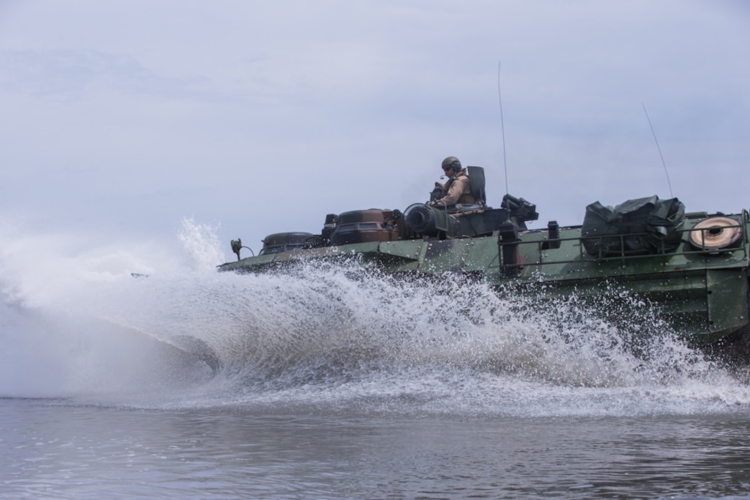 U.S. Marines with 2d Assault Amphibious Battalion (AABn), 2d Marine Division (MARDIV) conduct raid rehearsal training in an amphibious assault vehicle at Camp Lejeune, North Carolina, May 6, 2020. This training focuses on Marines’ abilities to enter and exit the water efficiently and effectively. (U.S. Marine Corps photo by Lance Cpl. Reine Whitaker)
