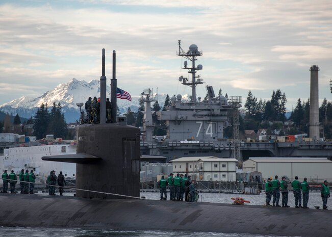 he Los Angeles-class fast-attack submarine USS Olympia (SSN 717) arrives at Puget Sound Naval Shipyard for a port visit.