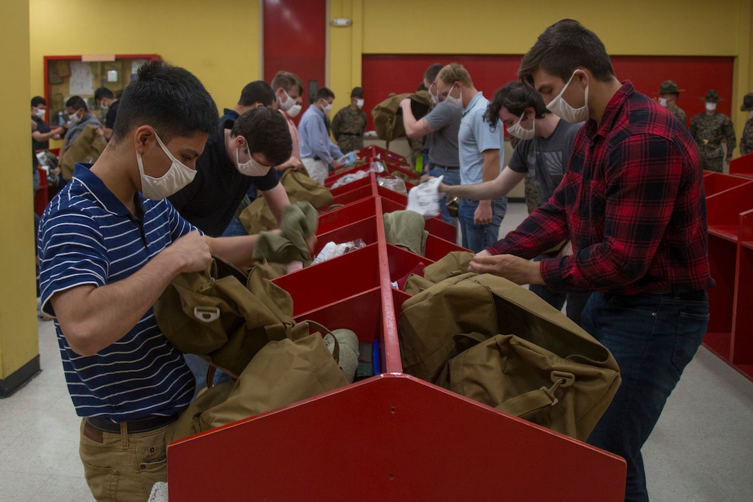 New recruits with India Company, 3rd Recruit Training Battalion, receive a contraband brief during receiving at Marine Corps Recruit Depot, San Diego, May 15, 2020. At this point, recruits are informed of the articles under the Uniform Code of Military Justice. (U.S. Marine Corps photo by Cpl. Brooke C. Woods)
