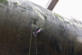 prototype hull-climbing robot conducts its first test on an actual vessel, the Seawolf-class attack submarine USS Connecticut (SSN 22), in dry dock at Puget Sound Naval Shipyard and Intermediate Maintenance Facility (PSNS & IMF).