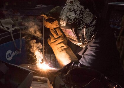 Hull Maintenance Technician Fireman Keriyate Lewis, from New Iberia, La., welds a metal brace aboard the aircraft carrier USS Dwight D. Eisenhower (CVN 69).