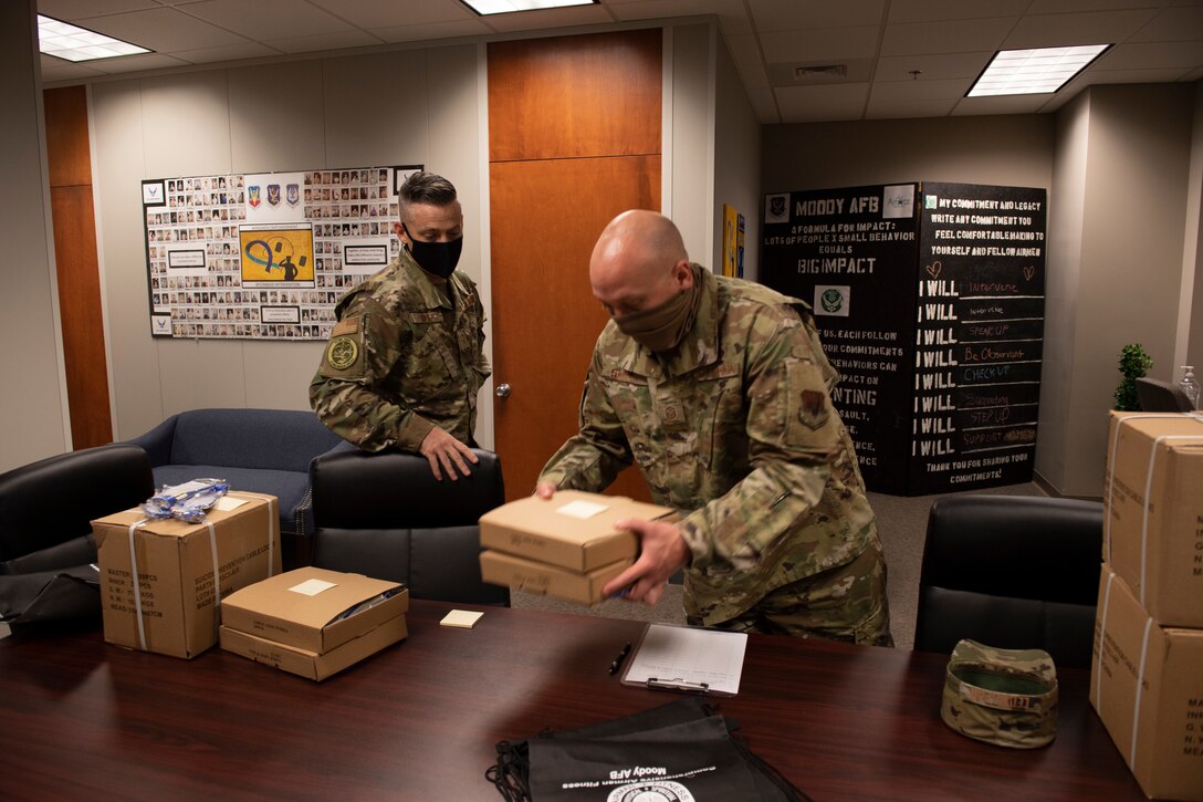An Airman places locks into a bag