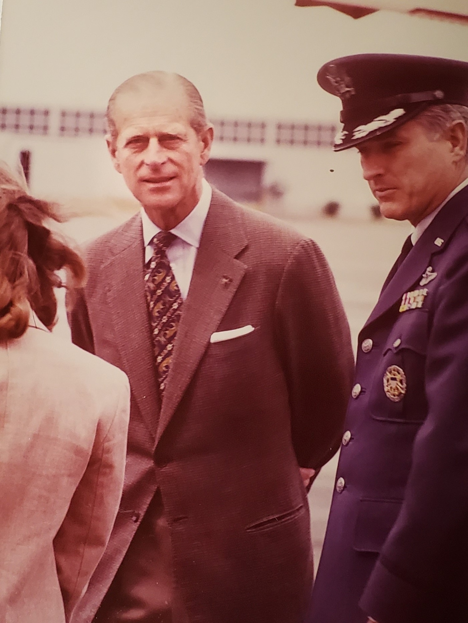 Prince Philip from Great Britain, left, stands beside Col. Donald Smith, 62nd Airlift Wing commander, after landing at McChord, Wash., May 22, 1980.