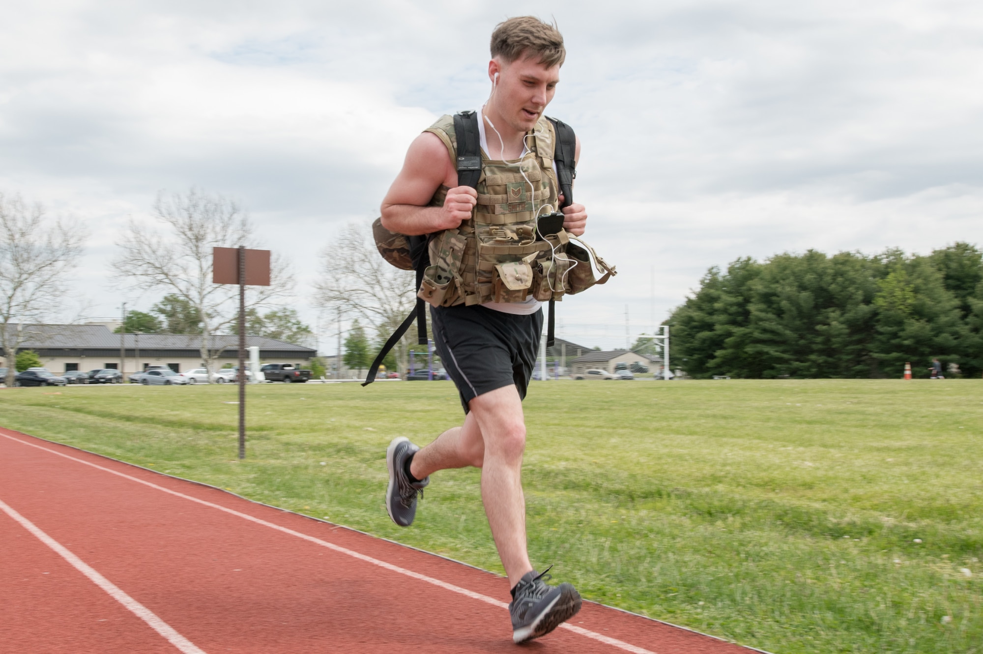 Staff Sgt. Stephen Smith, 436th Security Forces Squadron response force member, runs while wearing body armor and carrying a ruck during the 2020 Police Week Ruck March May 14, 2020, at Dover Air Force Base, Delaware. The 436th SFS hosted the 24-hour event commemorating fallen military and civilian law enforcement officers. (U.S. Air Force photo by Mauricio Campino)