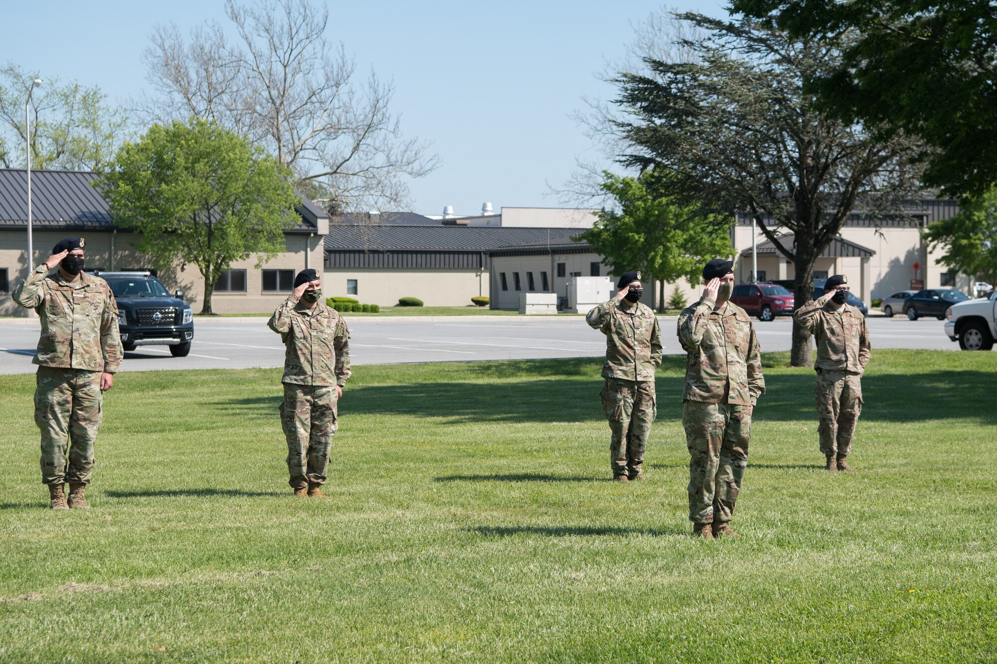 Members of the 436th Security Forces Squadron salute the American flag during a retreat ceremony on Peace Officers Memorial Day May 15, 2020, at Dover Air Force Base, Delaware. Despite the COVID-19 virus, the 436th SFS was able to host the ceremony by limiting the number of participants, practicing social distancing and wearing personal protective equipment. (U.S. Air Force photo by Mauricio Campino)