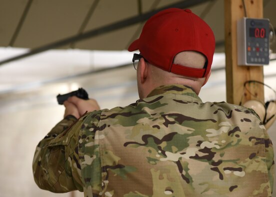 U.S. Air Force Staff Sgt. Christopher Drouin, 17th Security Forces combat arms instructor, lines up his shot during the Excellence in Competition pistol match on Goodfellow Air Force Base, Texas, May 15, 2020. The EIC was held to celebrate police week and gave members of Goodfellow a chance to show their talents off in a friendly competition. (U.S. Air Force photo by Airman 1st Class Ethan Sherwood)