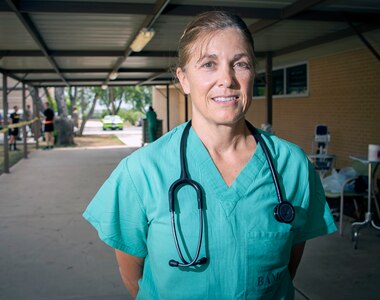 U.S. Army Col. April Critelli, physician assistant, prepares to end her work day at the McWethy Troop Medical Clinic at Joint Base San Antonio-Fort Sam Houston May 13. Critelli is the first medical Soldier to return to active duty from retirement during the COVID-19 crisis.
