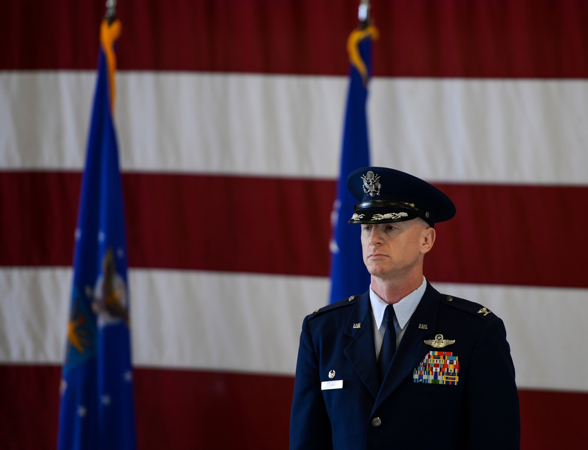 Col. Seth Graham, 14th Flying Training Wing commander, stands at attention during the wing’s change of command ceremony May 18, 2020, at Columbus Air Force Base, Miss. Prior to serving as commander, Graham was the 509th Bomb Wing commander at Whiteman AFB, Mo. (U.S. Air Force photo by Airman 1st Class Davis Donaldson)