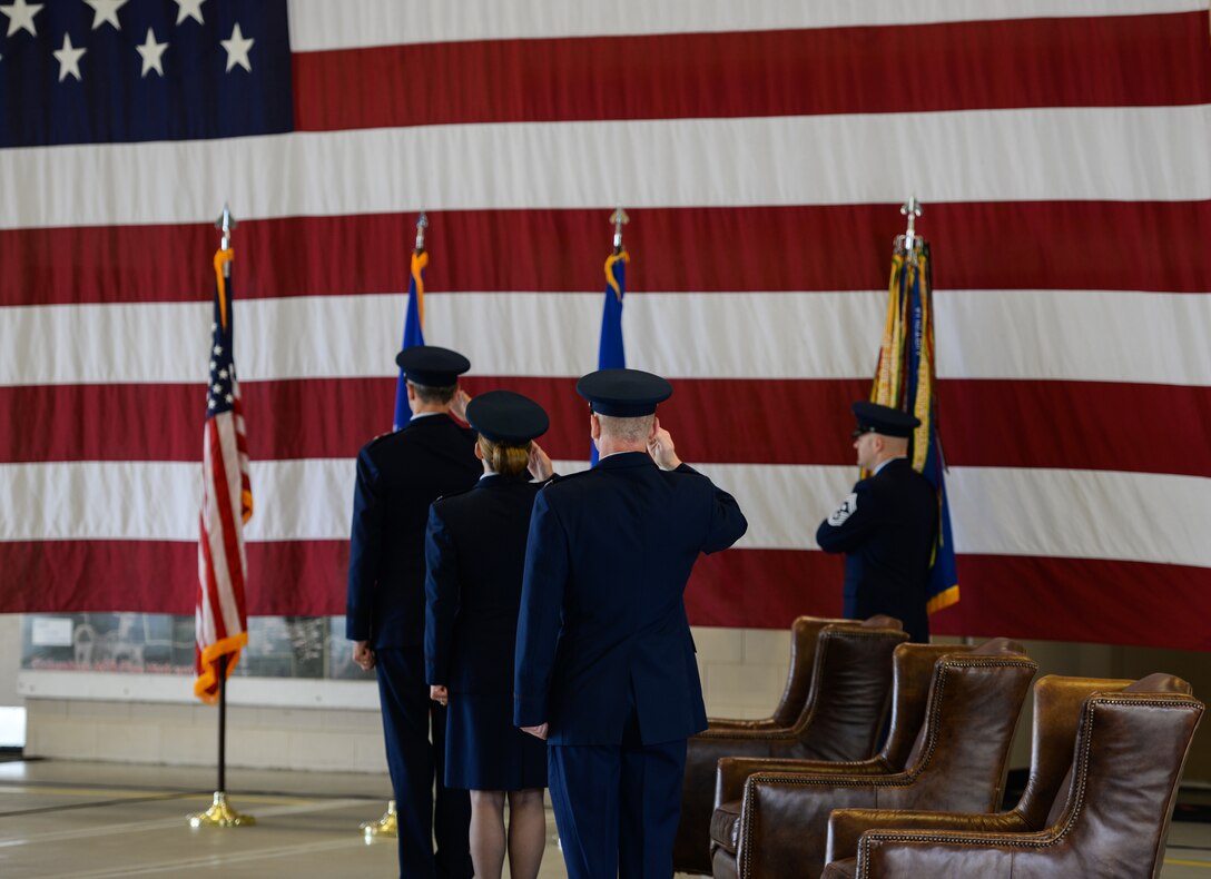 Maj. Gen. Craig Wills, 19th Air Force commander, Col. Samantha Weeks, former 14th Flying Training Wing commander, and Col. Seth Graham, 14th Flying Training Wing commander, salute during the 14th FTW change of command ceremony  May 18, 2020 at Columbus Air Force Base, Miss. Following the change of command ceremony, Weeks will retire after 23 years of faithful service to the Air Force. (U.S. Air Force photo by Airman 1st Class Davis Donaldson)