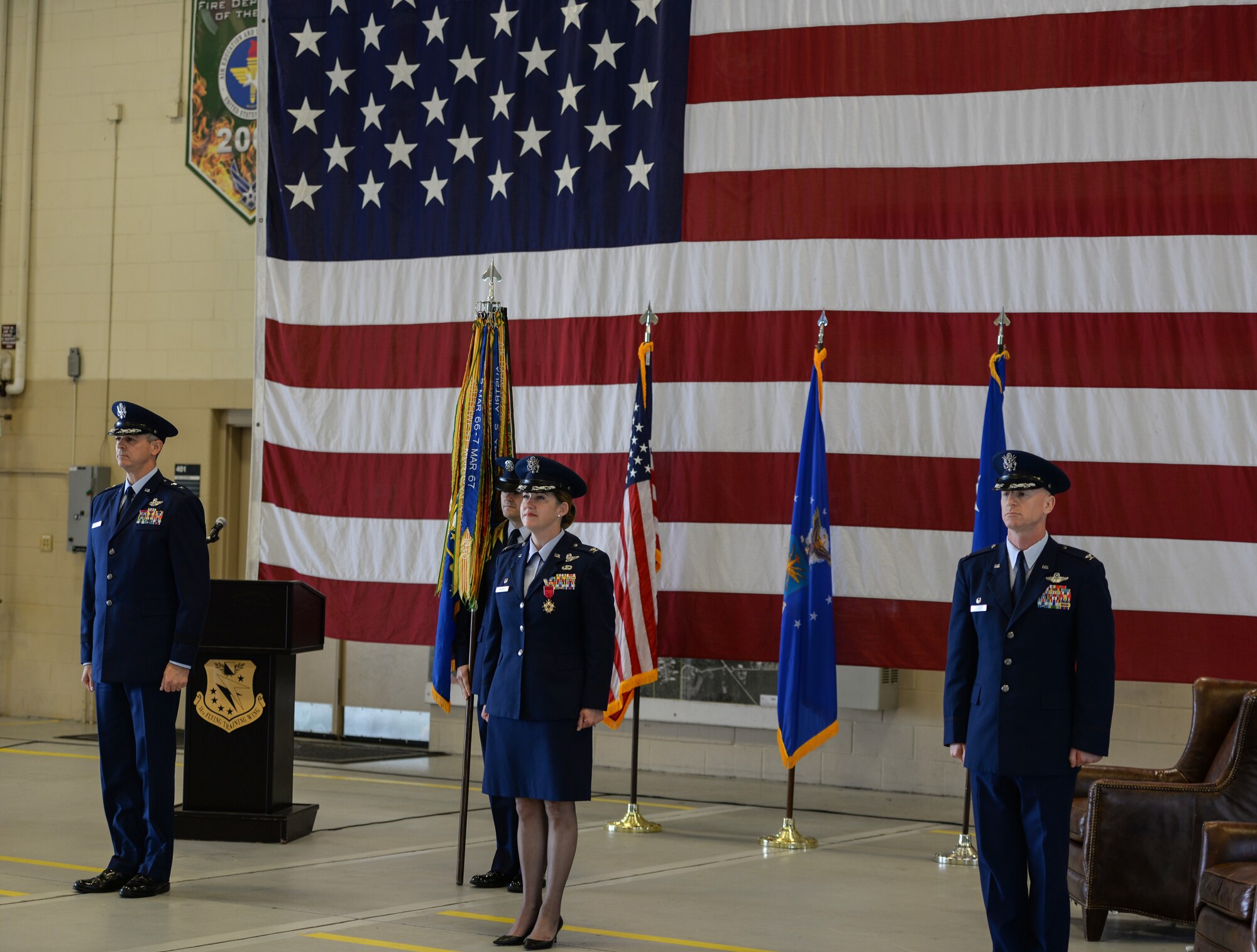Maj. Gen. Craig Wills, 19th Air Force commander, Col. Samantha Weeks, former 14th Flying Training Wing commander, and Col. Seth Graham, 14th Flying Training Wing commander, stand at attention during the 14th FTW change of command ceremony on May 18, 2020 at Columbus Air Force Base, Miss. Graham is a B-1B Lancer pilot. (U.S. Air Force photo by Airman 1st Class Davis Donaldson)
