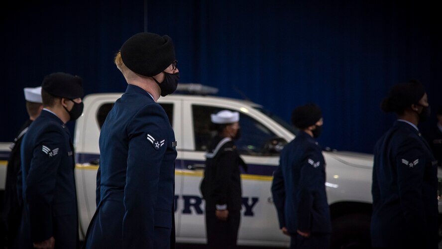 Misawa Air Base defenders stand in formation during the final guard mount ceremony at Misawa AB, Japan, May 15, 2020. This ceremony is held to honor the law enforcement personnel who died in the line of duty at home and abroad by calling out their names as the flight sergeant conducts roll call. Fallen Airmen included names such as Airman First Class Elizabeth Jacobson, who died while providing escort security for a convoy of service members in the Middle East during Operation Iraqi Freedom. (U.S. Air Force photo by Airman 1st Class China M. Shock)