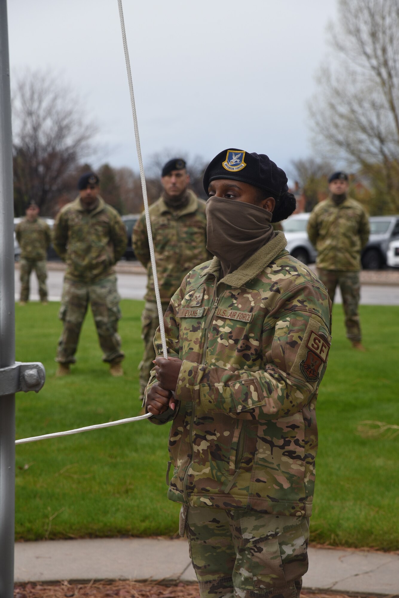 Airman lowers flag