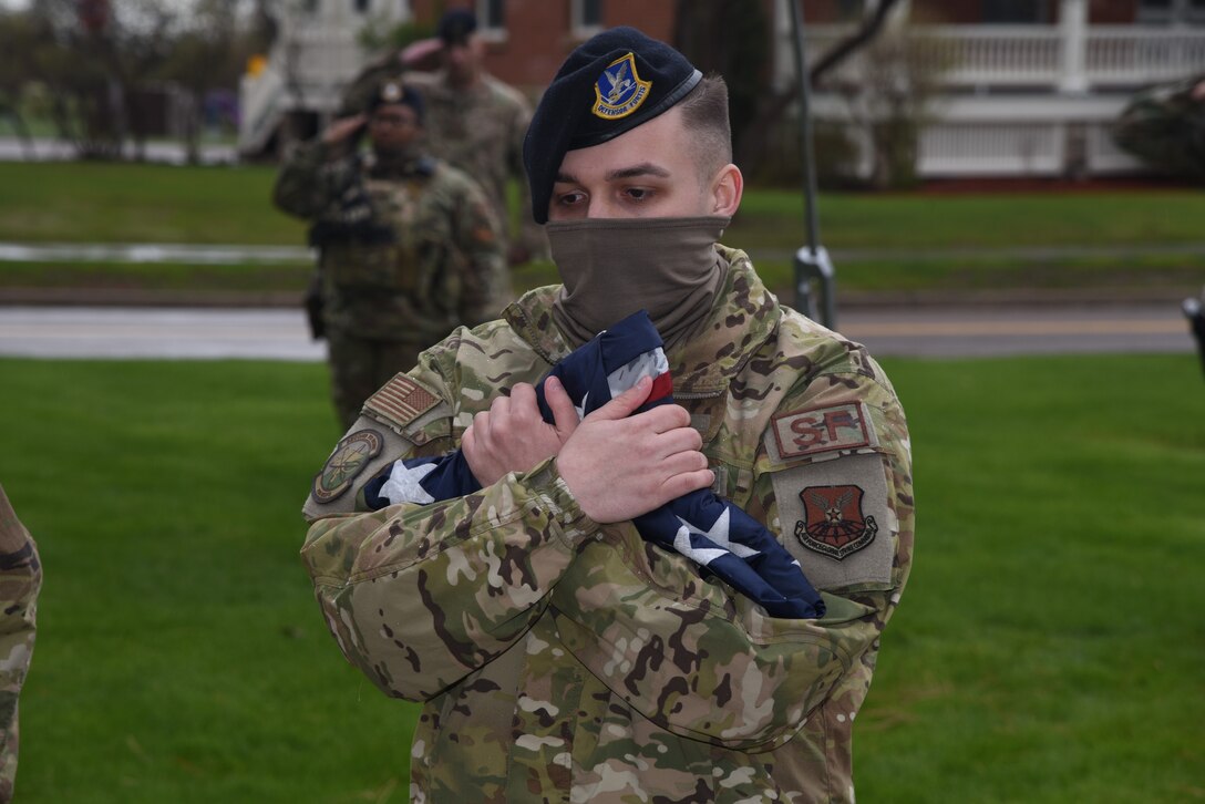 Airman holds flag
