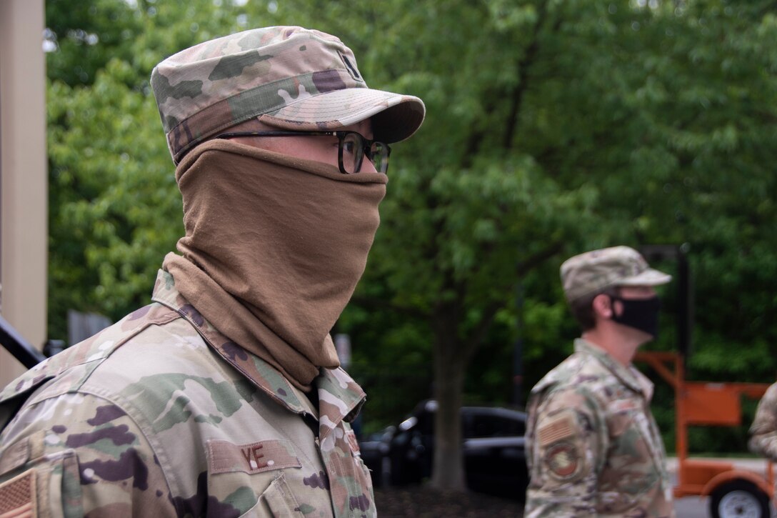 U.S. Air Force 1st Lt. Jiahua Ye, left, promotes to captain at the Union County COVID-19 testing site located at Kean University in Union, N.J., May 18, 2020.  Ye is serving as the officer in charge of the testing site and is responsible for ensuring the Guardsmen’s needs are met in order to accomplish the mission. (U.S. Air National Guard photo by Senior Airman Julia Santiago)