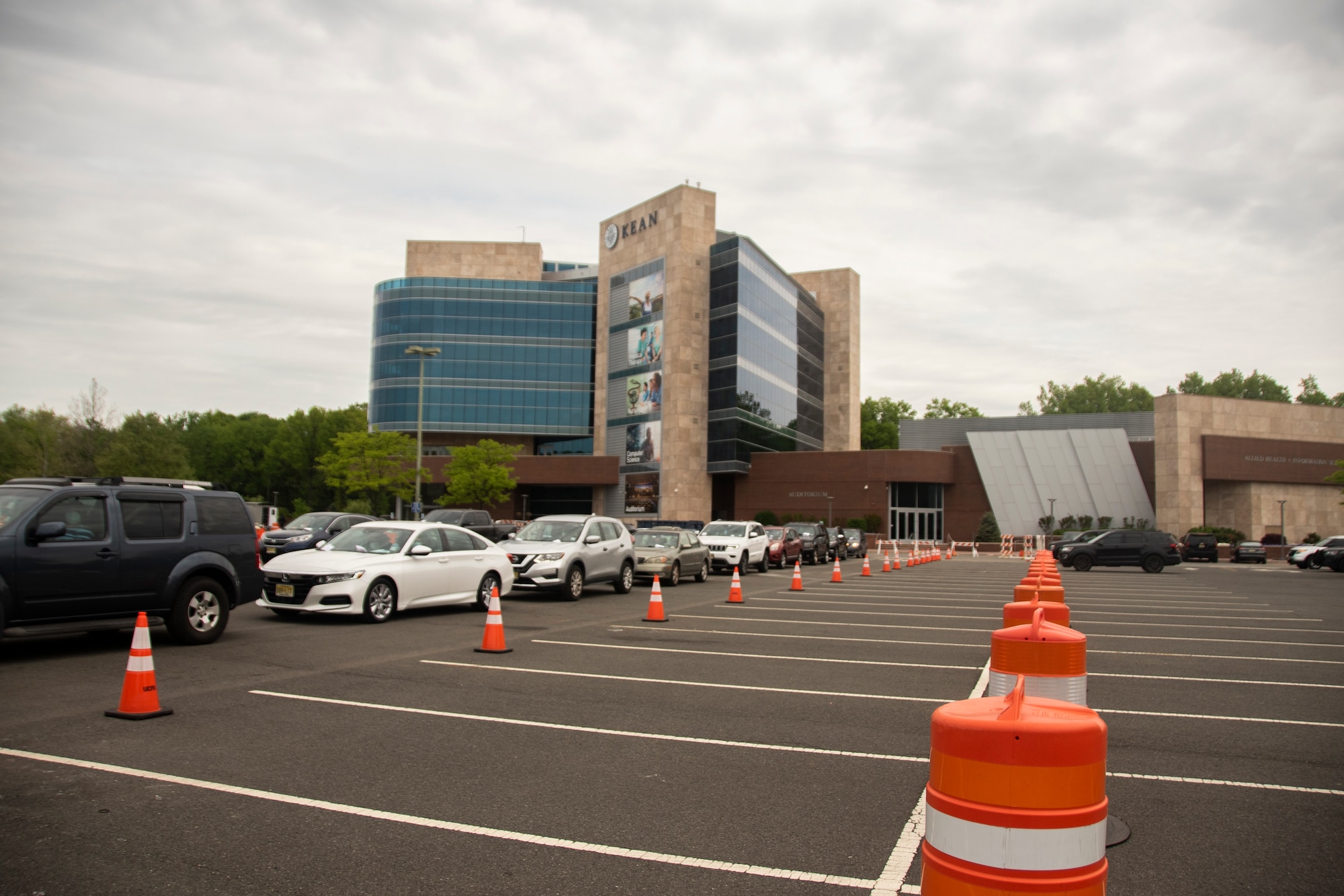 Cars line up for testing at the Union County COVID-19 drive-through, testing site located at Kean University in Union, N.J., May 18, 2020.  The New Jersey National Guard is working with Union County to provide security and traffic control at Kean University. (U.S. Air National Guard photo by Senior Airman Julia Santiago)
