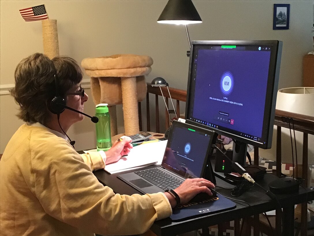 lady sits in front of computer