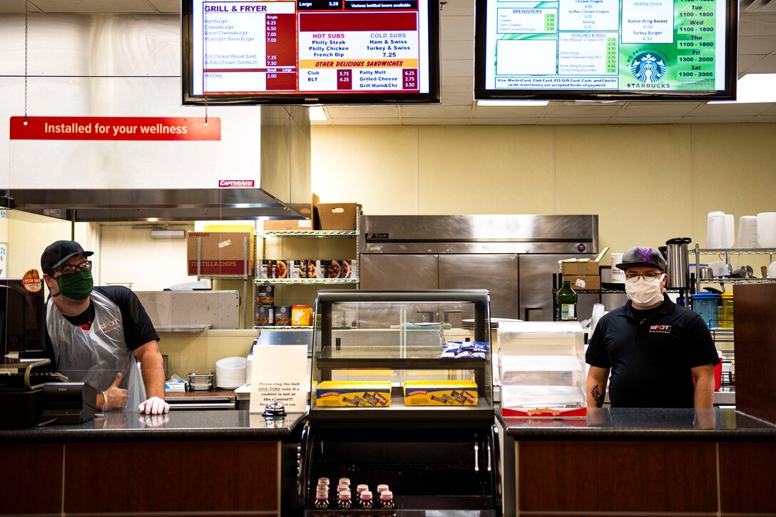 Photo of food service workers posing for a photo.