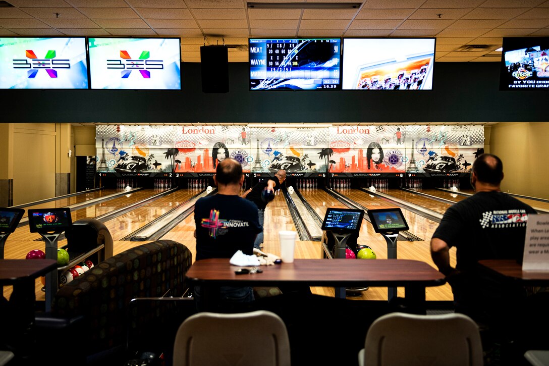 Photo of patrons bowling.