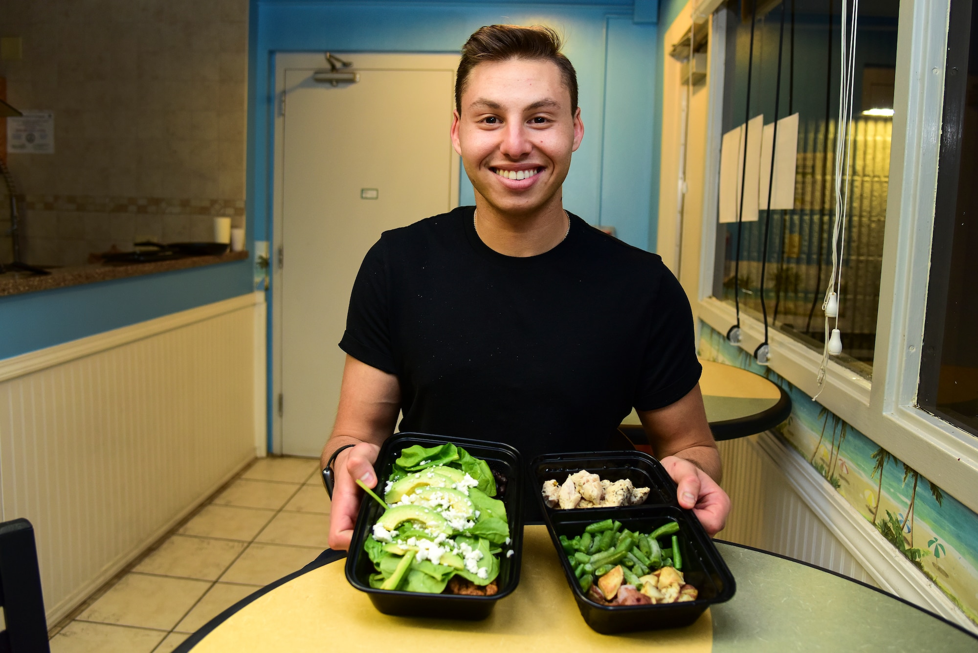 Airman 1st Class Matthew Blasberg, 47th Healthcare Operations Squadron referral management and patient travel technician, presents his lunch and dinner meal preps, May 5, 2020 at Laughlin Air Force Base, Texas. Blasberg continually learns more about nutrition and how to apply it to his meal preps. Having been meal prepping for two years, he has come far from the baby-faced graduate considering joining the U.S. Air Force.  (U.S. Air Force photo by Senior Airman Anne McCready)