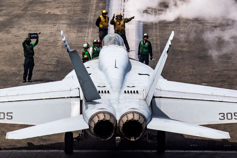 An F/A-18E Super Hornet, assigned to the "Knighthawks" of Strike Fighter Squadron 136, lines up on a catapult on the flight deck of the Nimitz-class aircraft carrier USS Harry S. Truman (CVN 75) in the Atlantic Ocean May 12, 2020. The Harry S. Truman Carrier Strike Group remains at sea in the Atlantic as a certified carrier strike group force ready for tasking in order to protect the crew from the risks posed by COVID-19, following their successful deployment to the U.S. 5th and 6th Fleet areas of operation. Keeping HSTCSG at sea in U.S. 2nd Fleet, in the sustainment phase of OFRP, allows the ship to maintain a high level of readiness during the global COVID-19 pandemic. (U.S. Navy photo by Mass Communication Specialist 2nd Class Tamara Vaughn)