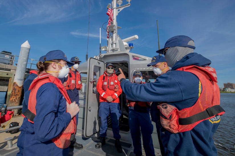 Boatswains Mate 3rd class Max Alderman provides a risk assessment brief to crew members prior to Man Overboard training May 12, 2020, at Coast Guard Station Charleston, S.C.