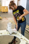 Ladawn McClain, general equipment mechanic, works on a cupola for an M-88 HERCULES tank retriever at Production Plant Barstow, Marine Depot Maitenance Command aboard the Yermo Annex of Marine Corps Logistics Base Barstow, Calif., May 8. She said her time with her family was good during the two-week off one week on COVID-19 restrictions, but it is good to be back at work. She feels she "is blessed to have a job."