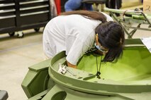 Debbie Brobst, heavy mobile equipment mechanic, works on a turret for an Amphibious Assault Vehicle, at Production Plant Barstow, Marine Depot Maintenance Command, aboard the Yermo Annex of Marine Corps Logistics Base Barstow, May 8. The 40-year veteran HMEM said she is glad to be back at full shift at the Plant, but is still worried about the Coronavirus. She said she is glad that people are wearing their face masks and maintaining social distancing.