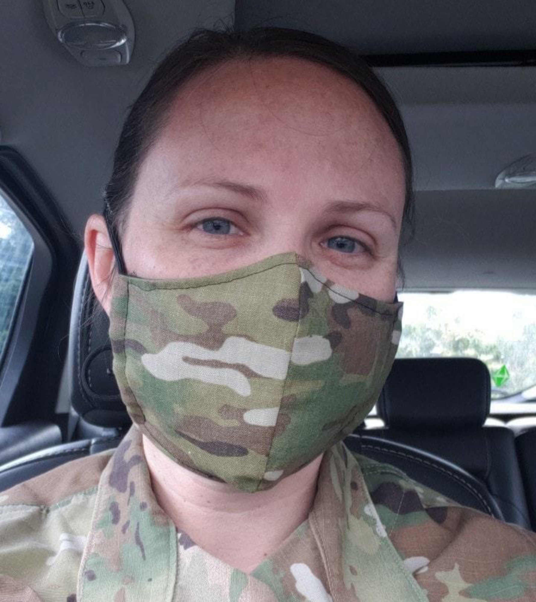 U.S. Air Force Staff Sgt. Rachel Yandon, a radio frequency transmission systems apprentice assigned to the 225th Support Squadron, Washington Air National Guard, wears a face mask like the ones she donated to mission essential personnel of the Western Air Defense Sector May 7, 2020.  Yandon also sewed and donated 150 masks to an Alabama hospital.