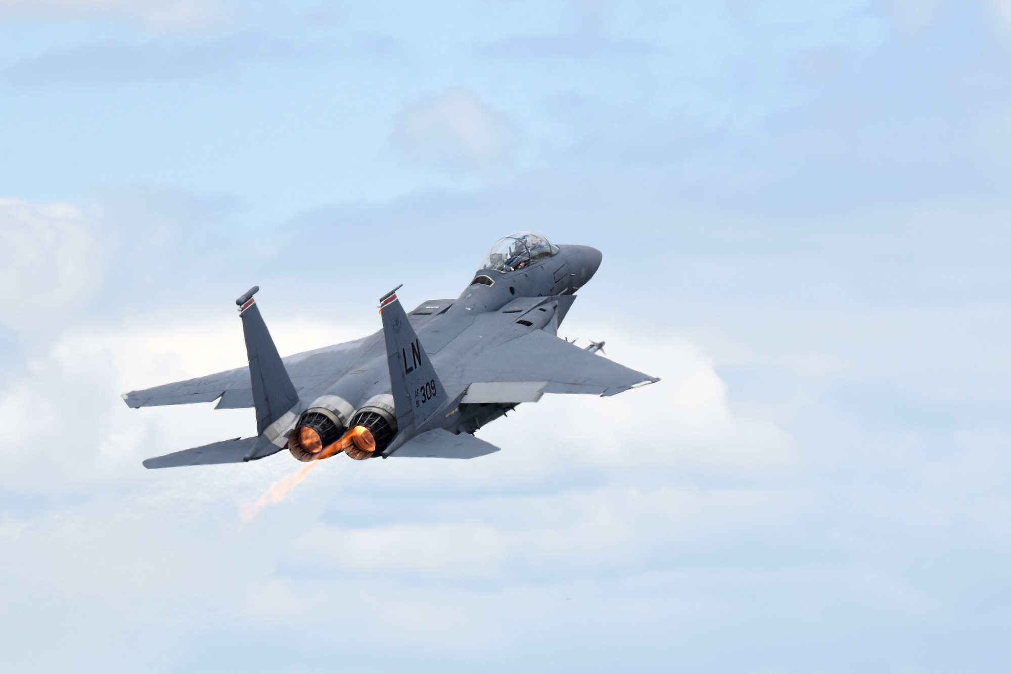 An F-15E Strike Eagle assigned to the 494th Fighter Squadron takes off at Royal Air Force Lakenheath, England, May 14, 2020. The F-15E Strike Eagle navigation system uses a laser gyro and a Global Positioning System to continuously monitor the aircraft's position and provide information to the central computer and other systems, including a digital moving map in both cockpits. (U.S. Air Force photo by Airman 1st Class Rhonda Smith)