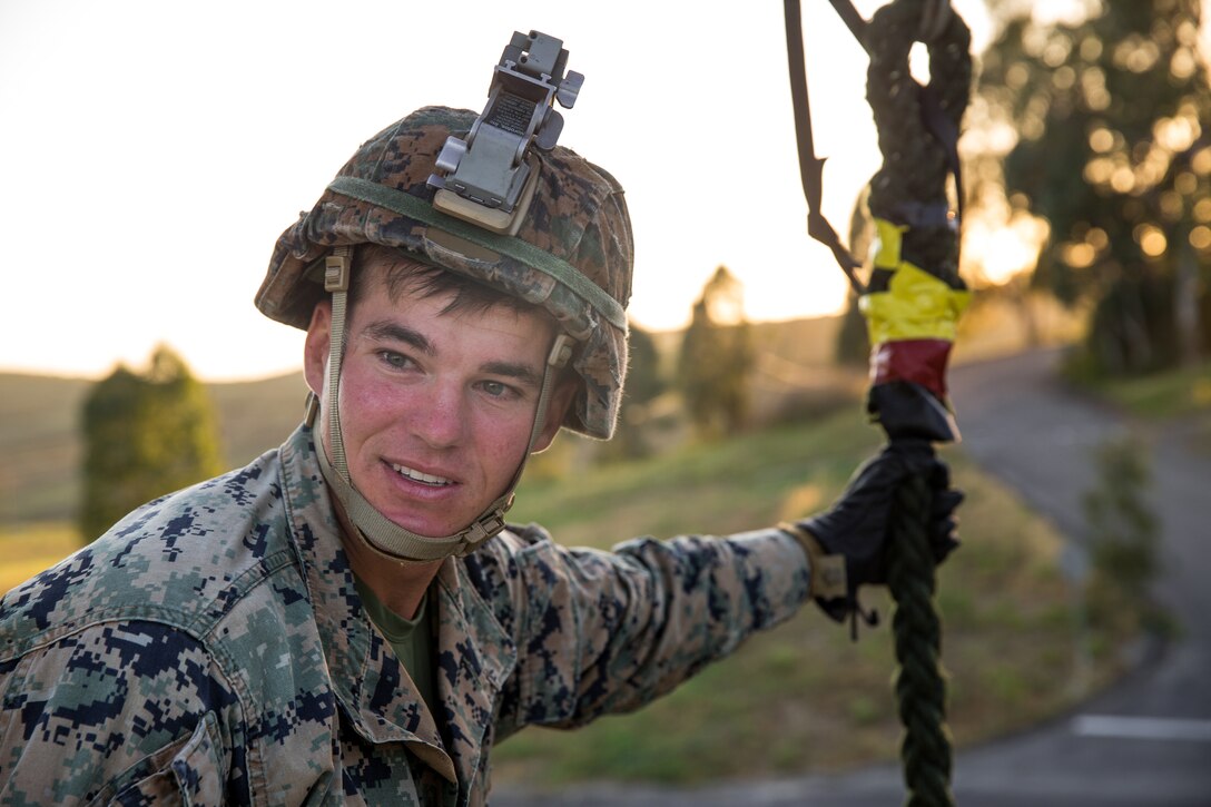 U.S. Marine Corps Cpl. Zack Smith, a team leader with Charlie Company, Battalion Landing Team 1/4, 15th Marine Expeditionary Unit, prepares a rope for the next Marine during fast-rope training at Marine Corps Base Camp Pendleton, California, May 14, 2020. Fast-rope training enables the BLT to conduct hasty insertions directly onto their objective, improving their ability to conduct various missions, such as conducting expeditionary strikes, raids or embassy reinforcement. (U.S. Marine Corps photo by Lance Cpl. Brendan Mullin)