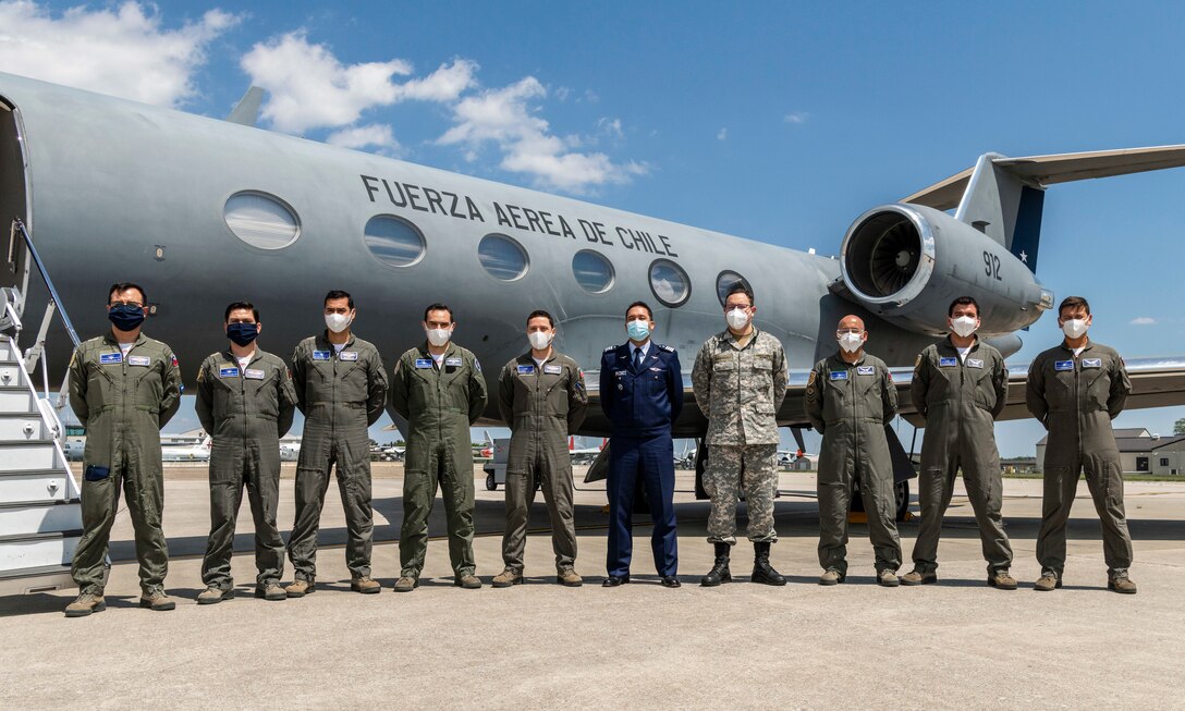 Chilean Air Force members pose for a group photo May 13, 2020, at Dover Air Force Base, Delaware. The U.S. Air Force and the Chilean Air Force continue the partnership throughout the battle against COVID-19. The Chilean Air Force made a stop in a Gulfstream IV to load cargo, in support of current USAF-FACh Foreign Military Sales projects.(U.S. Air Force photo by Senior Airman Christopher Quail)