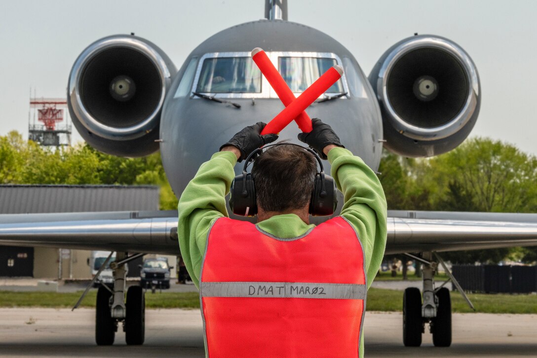 James Shedrick, 436th Aircraft Maintenance Squadron Transient Alert aircraft mechanic, marshals a Chilean Air Force Gulfstream IV May 13, 2020, at Dover Air Force Base, Delaware. The U.S. Air Force and the Chilean Air Force continue the partnership throughout the battle against COVID-19. The Chilean Air Force made a stop in a Gulfstream IV to unload and load cargo, sharing inventory between partner nations. (U.S. Air Force photo by Senior Airman Christopher Quail)