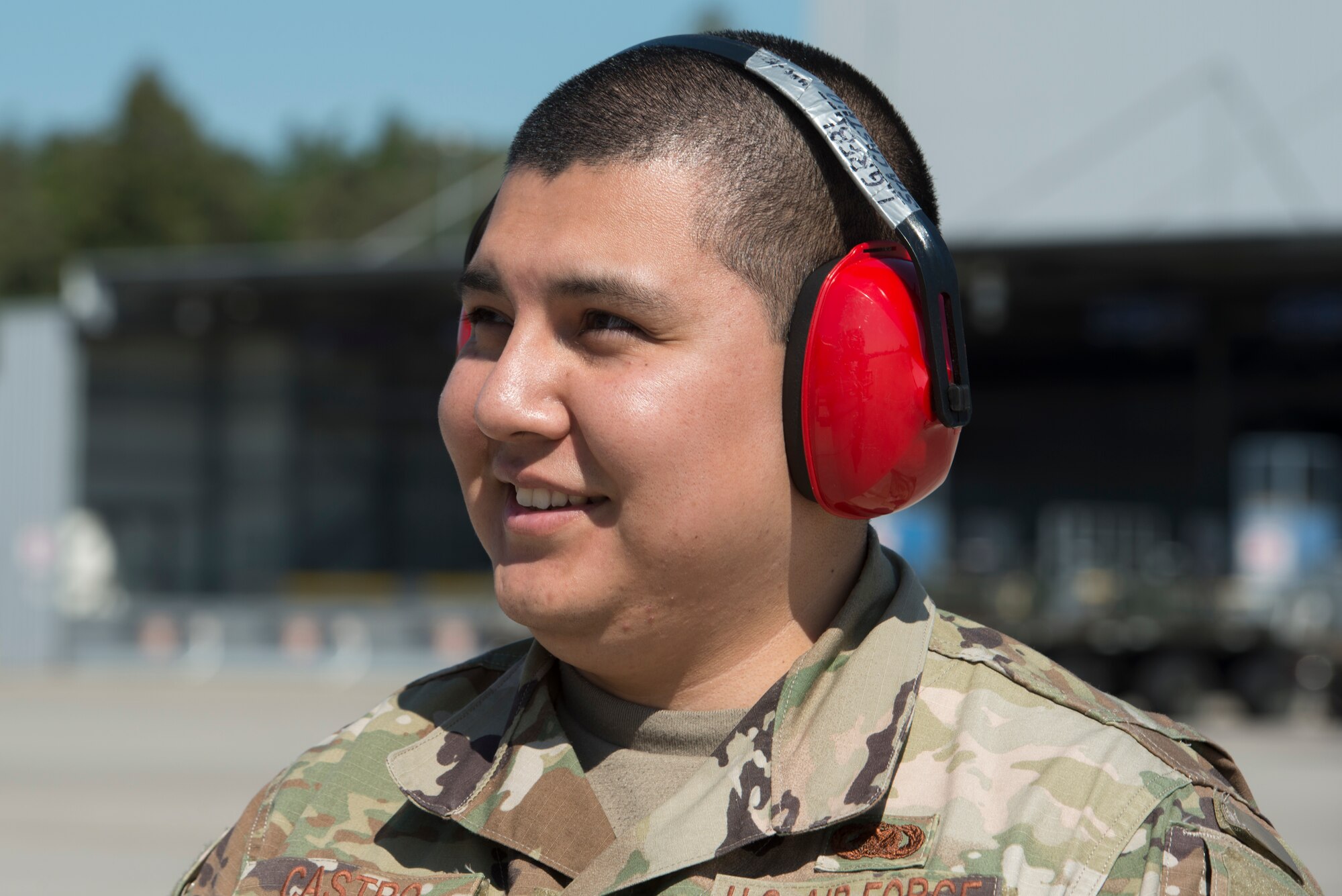 A photo of an Airmen smiling.