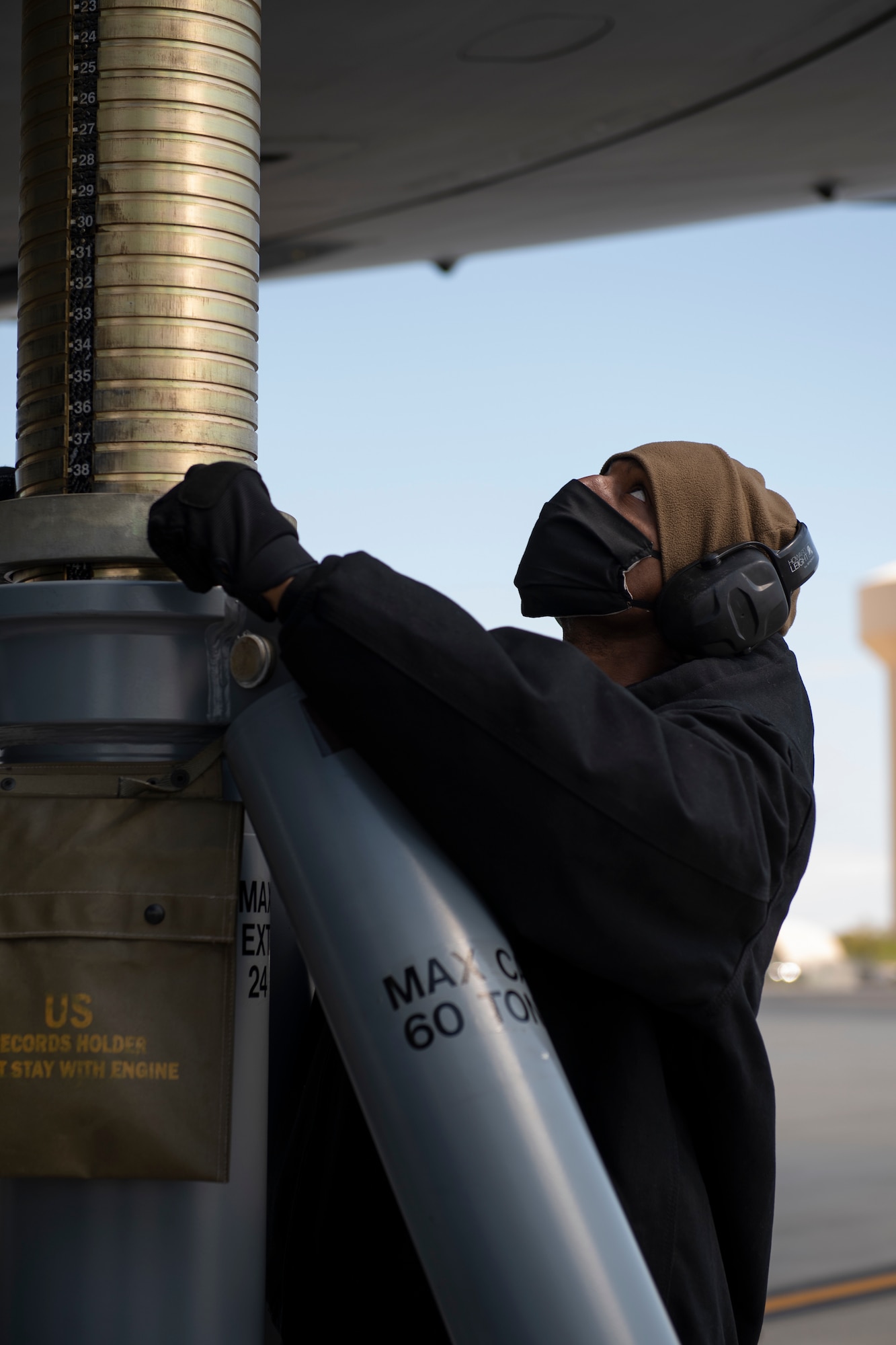 Staff Sgt. Larry Price, 911th Aircraft Maintenance Squadron aircraft maintainer, raises a jack to lift a C-17 Globemaster III during a home station check inspection at the Pittsburgh International Airport Air Reserve Station, Pennsylvania, May 12, 2020.