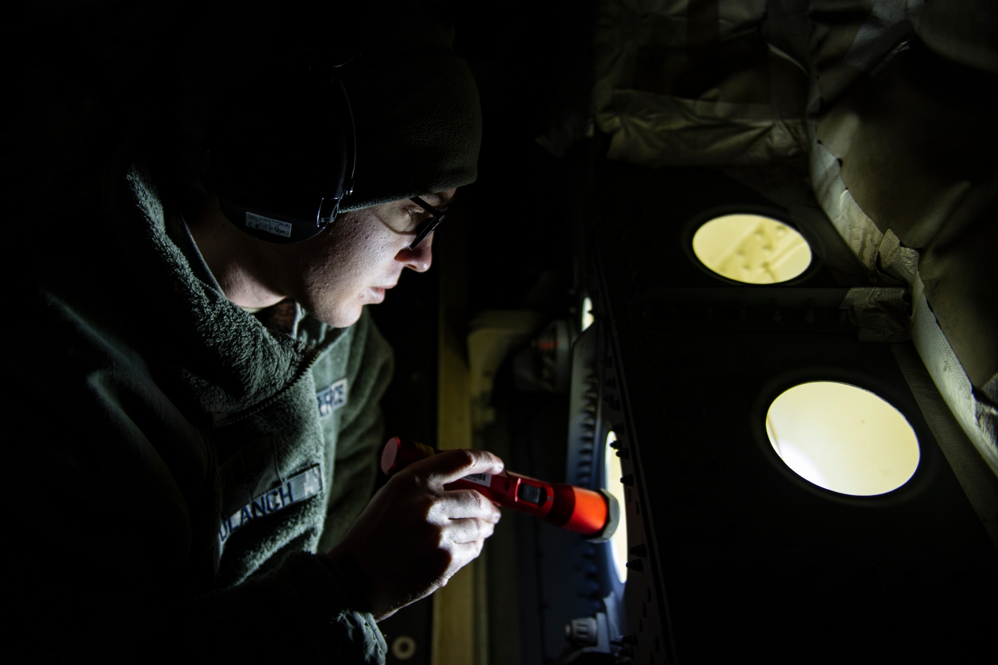Senior Airman Joey Ulanch, 911th Maintenance Squadron aircraft structural maintenance technician, inspects metal on the inside of a C-17 Globemaster III for any kind of damage during a Home Station Check inspection at the Pittsburgh International Airport Air Reserve Station, Pennsylvania, May 9, 2020.