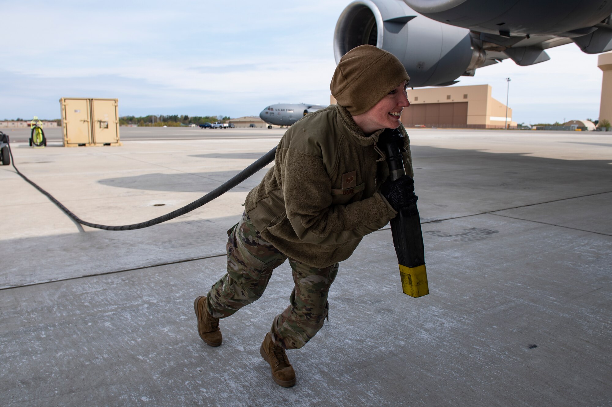 Staff Sgt. Holly Duke, 911th Maintenance Squadron home station check coordinator, prepares to hook up a power generator to a C-17 Globemaster III during a Home Station Check inspection at the Pittsburgh International Airport Air Reserve Station, Pennsylvania, May 10, 2020.