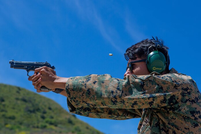 A U.S. Marine fires his M9 pistol during a live fire range on Camp Pendleton, California, May 7, 2020.