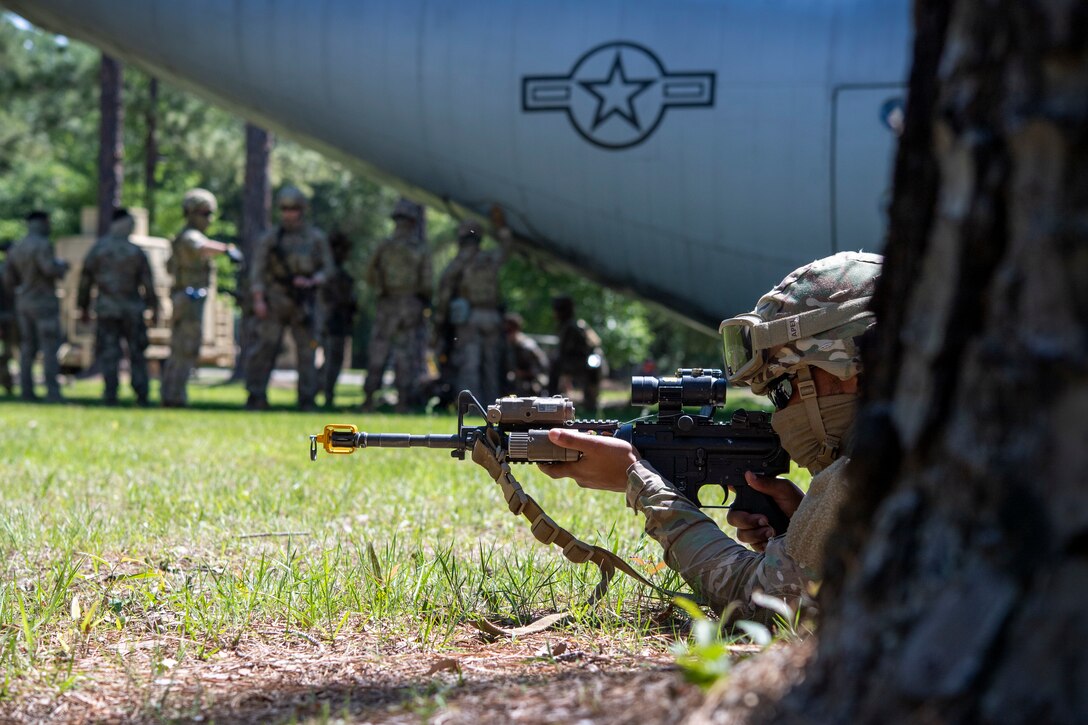 Airman keeps security during a training scenario